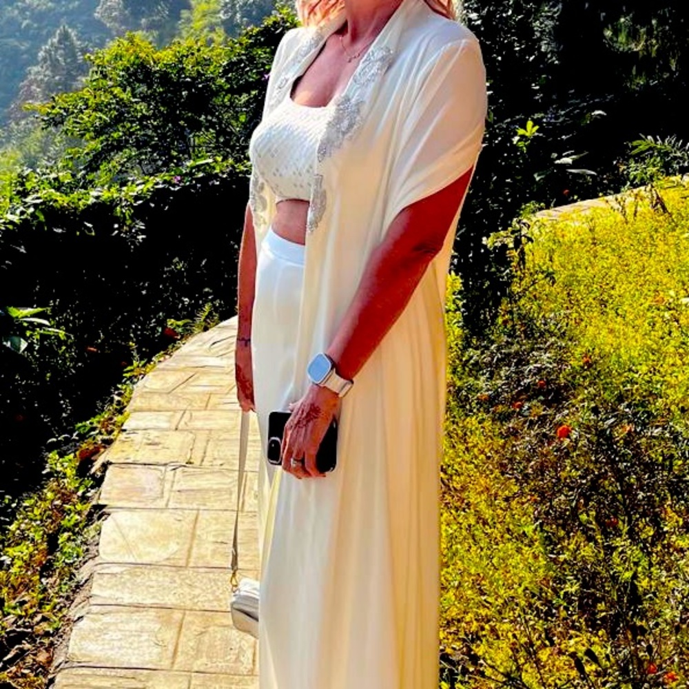 White outfit made by designer Zari Zara.  Haldi design.